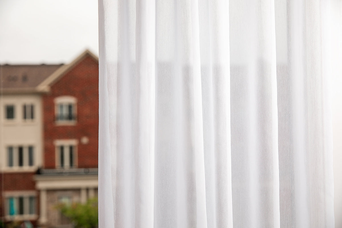 Two Dallas sheer panels falling in even vertical folds