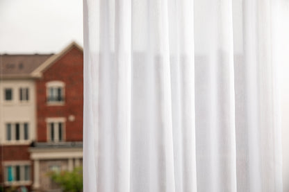 Two Dallas sheer panels falling in even vertical folds