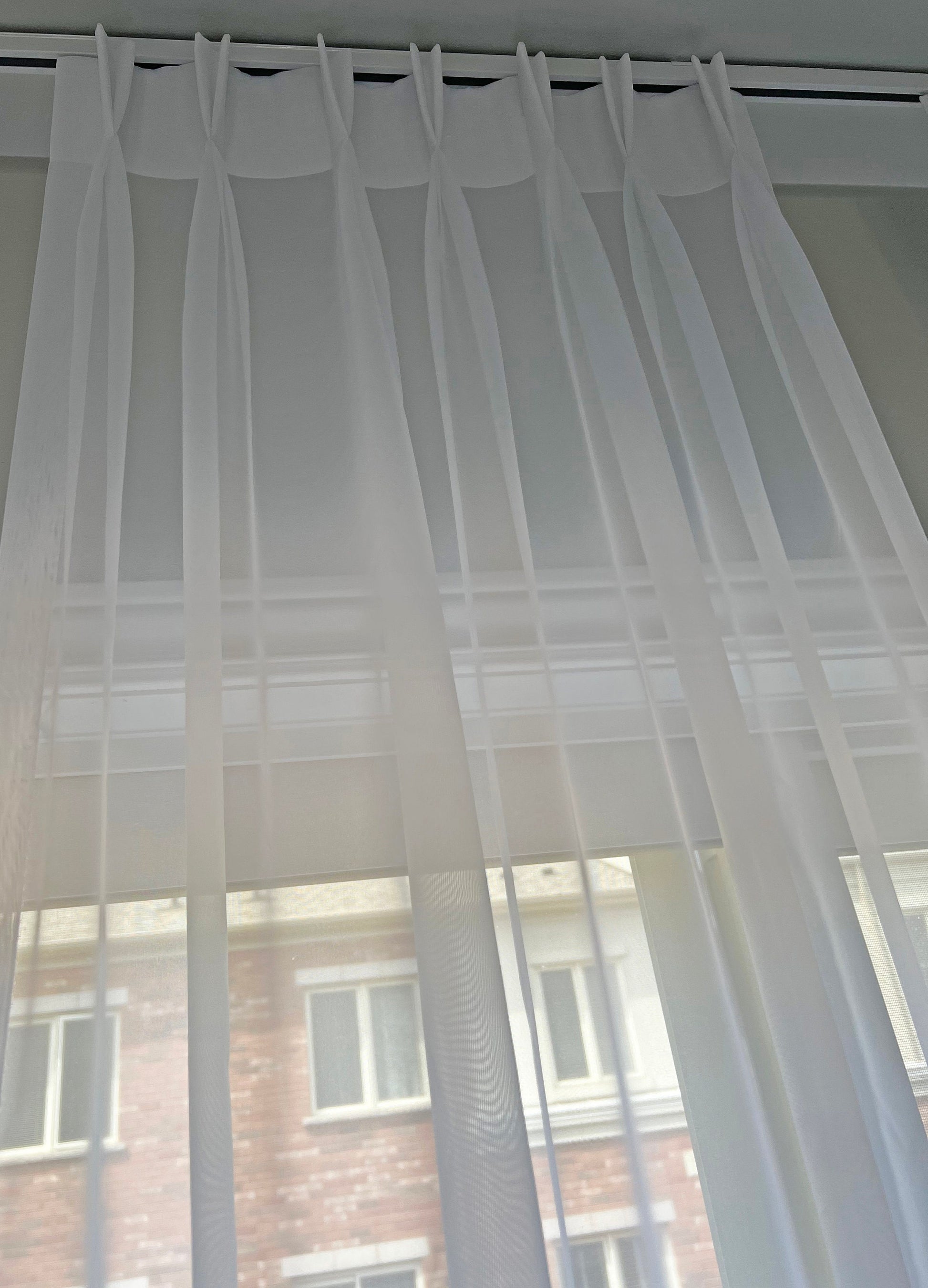 Daylight filtering through Empire voile pinch pleat sheer — LOGANOVA