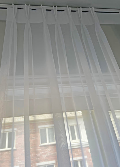 Daylight filtering through Empire voile pinch pleat sheer — LOGANOVA