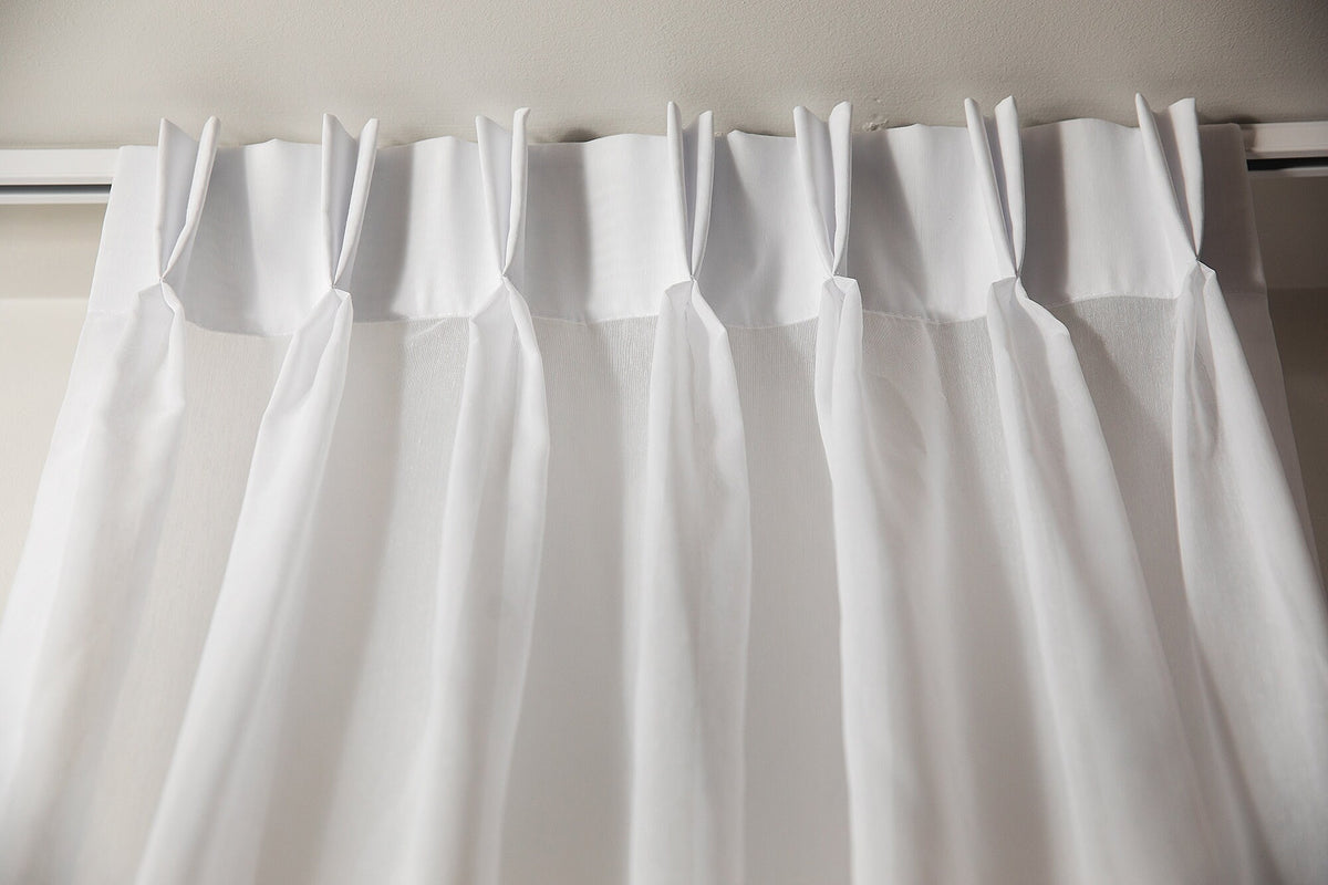 Close-up of the double pleat heading with pin hooks on a white track
