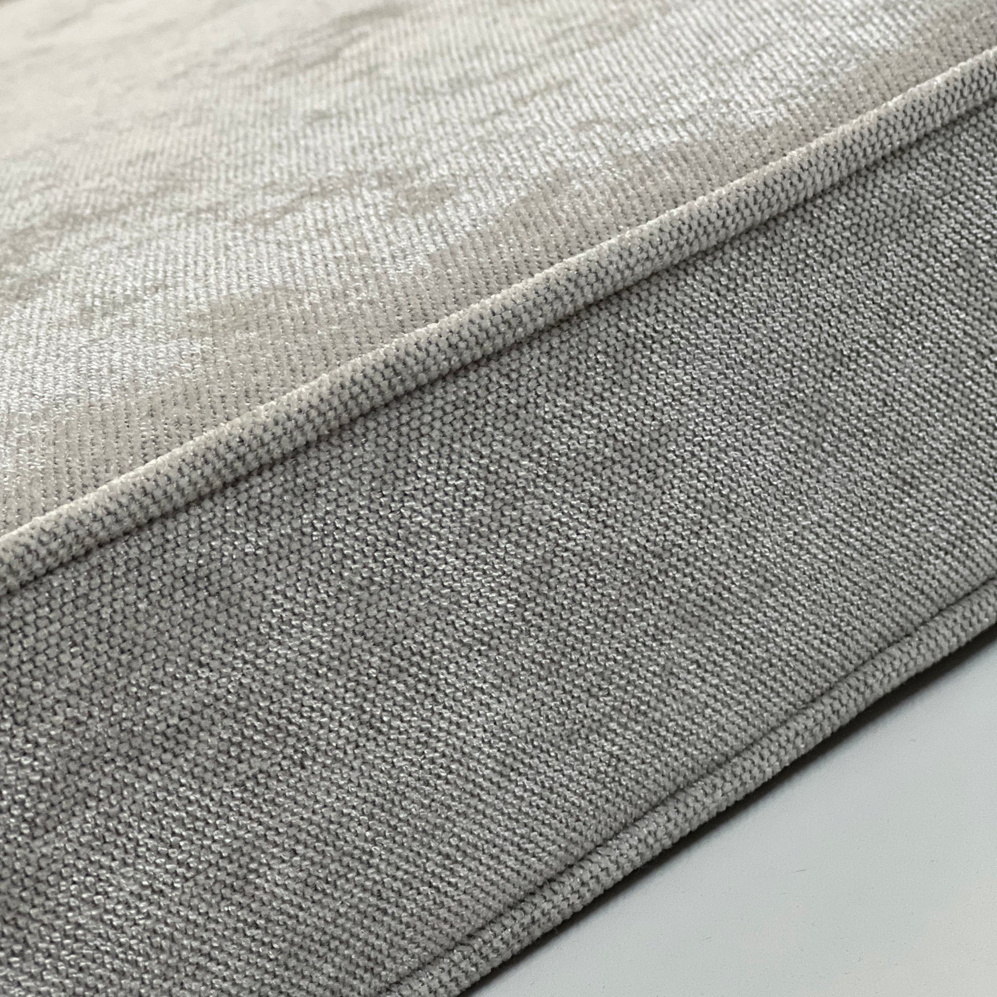 Piped edge of a made-to-order seat cushion, FibreGuard weave up close — LOGANOVA