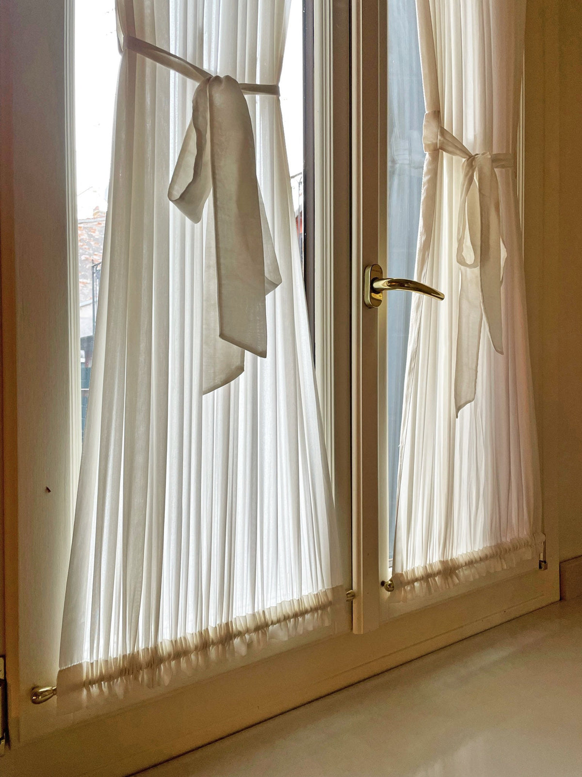 Privacy sheer cafe curtain filtering daylight