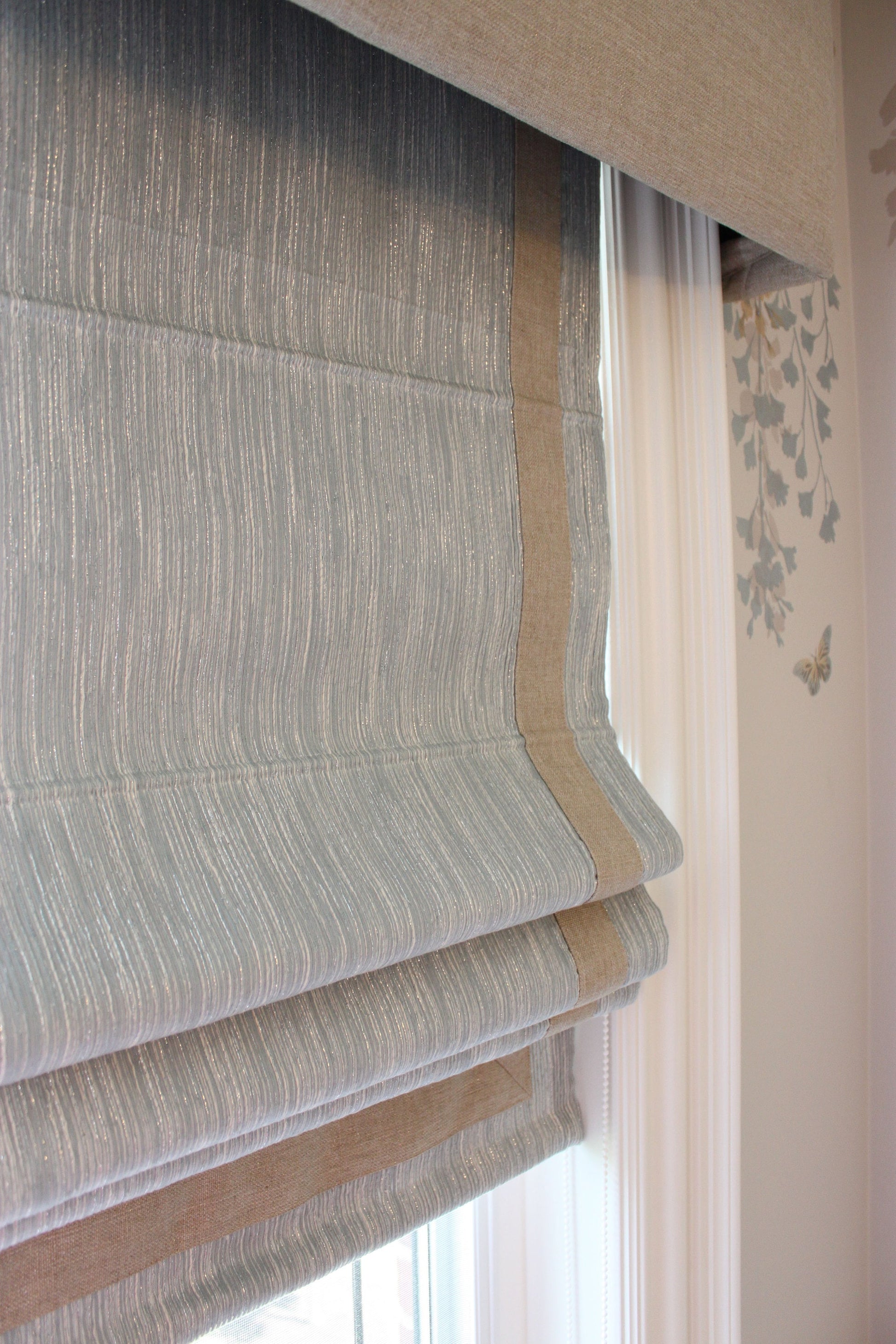 Cornice detail with curtain behind