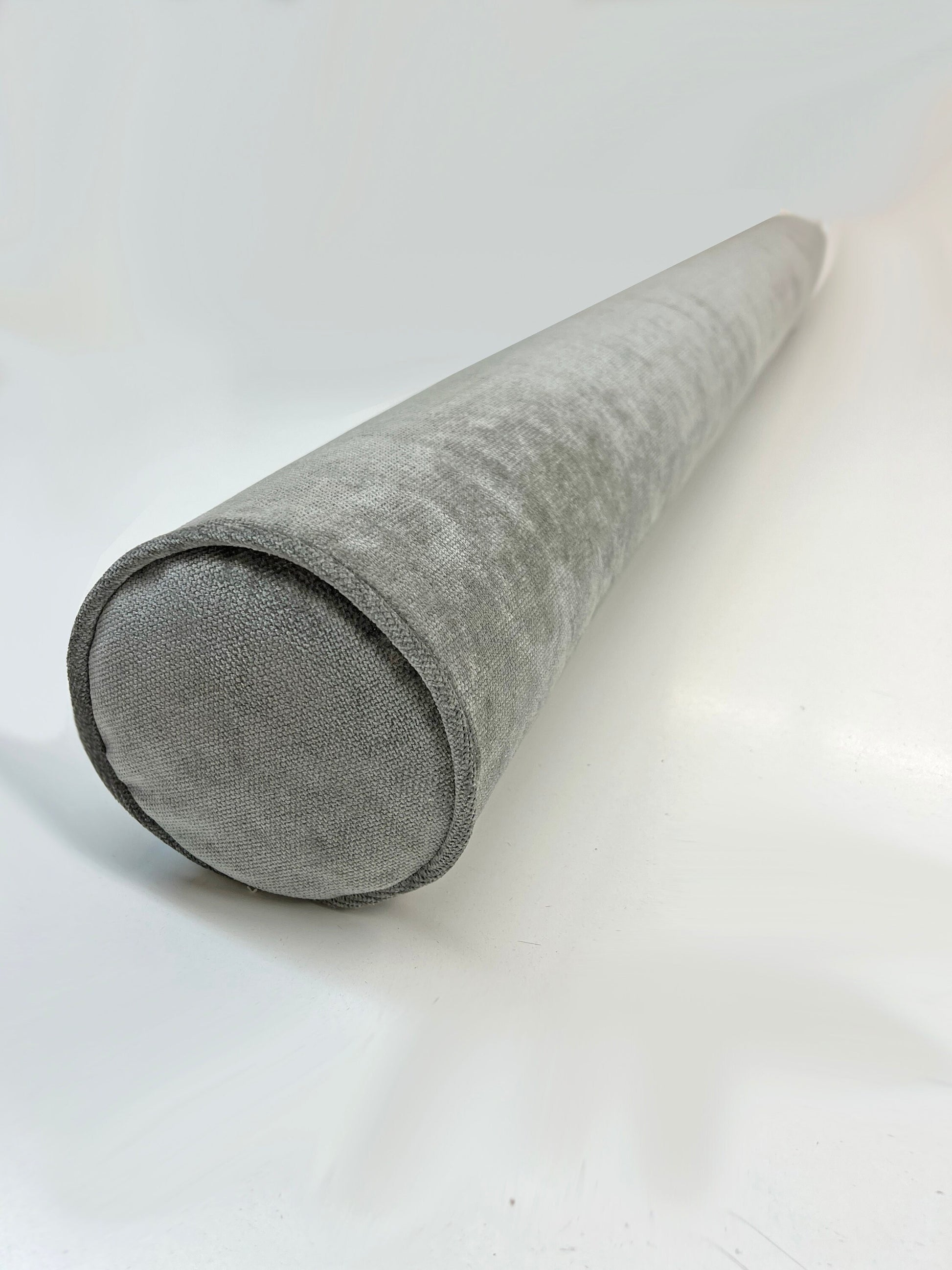 Custom bolster cushion in FibreGuard Mermaid grey with piped ends — LOGANOVA
