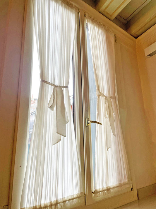 Kidman sheer cafe curtains with top and bottom pockets on a window