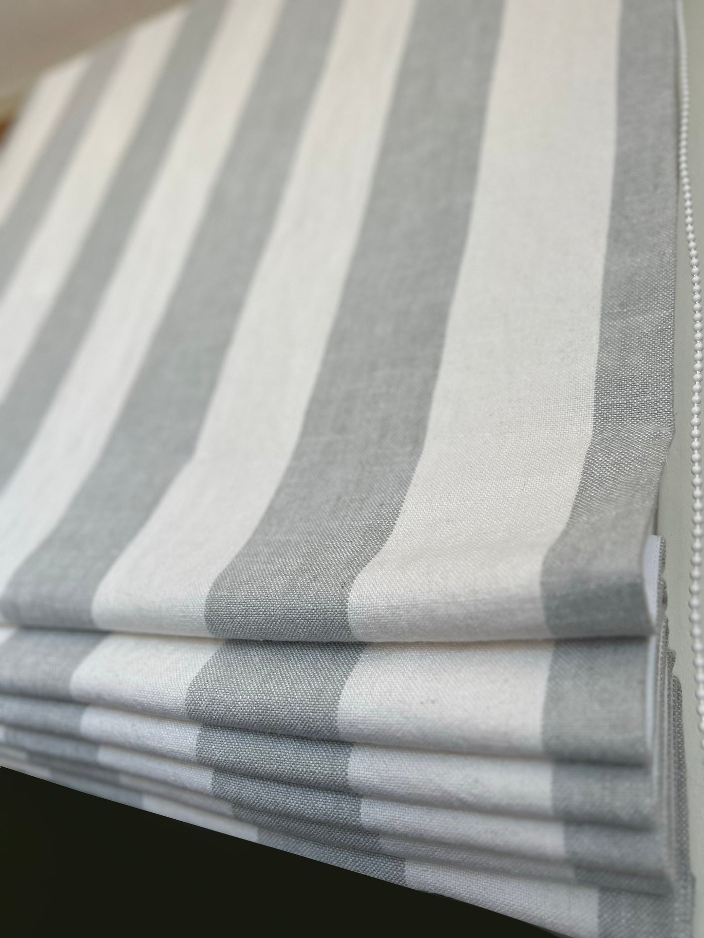 Copacabana linen Roman shade — neutral linen drape, handmade in Toronto