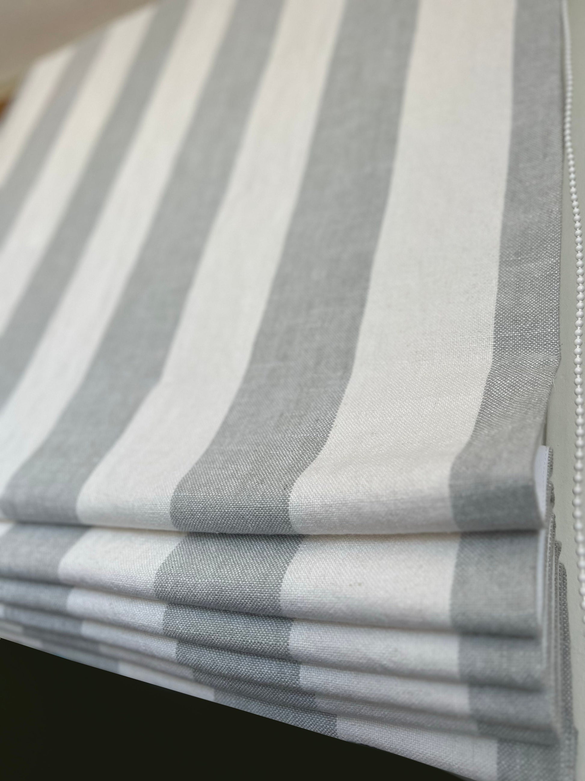 Copacabana linen Roman shade — neutral linen drape, handmade in Toronto