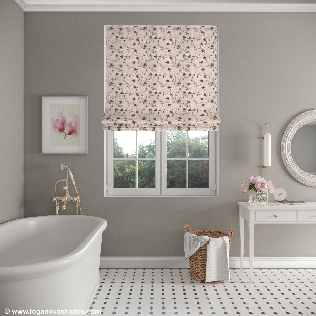 Light grey bathroom with Beatrix floral Roman shade above a white bathtub
