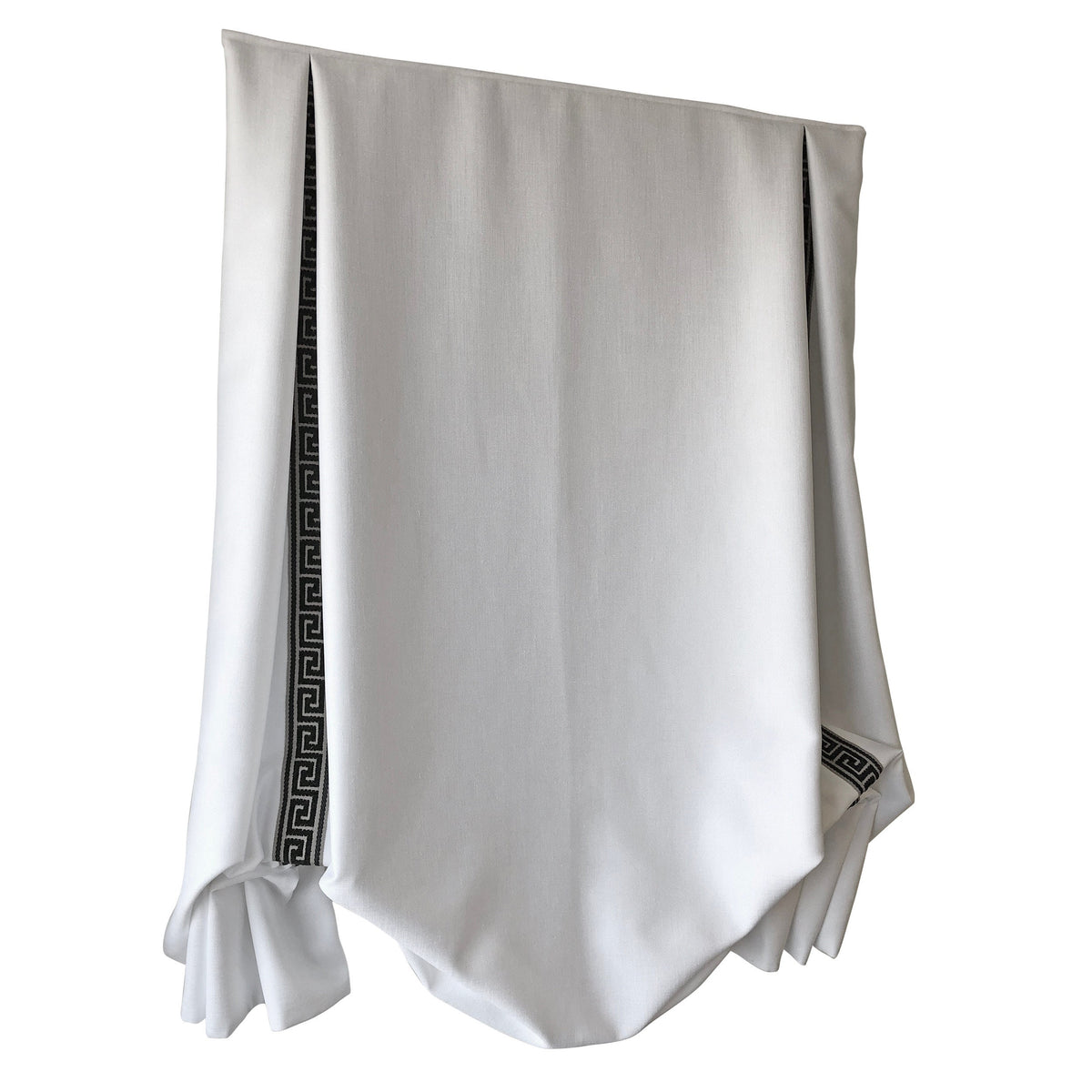 Close view of the tulip hem curve and Greek key trim on a white Cheval faux linen shade
