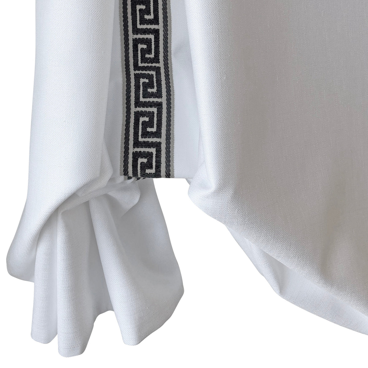 Cheval London tulip Roman shade in white faux linen with black and white Greek key trim