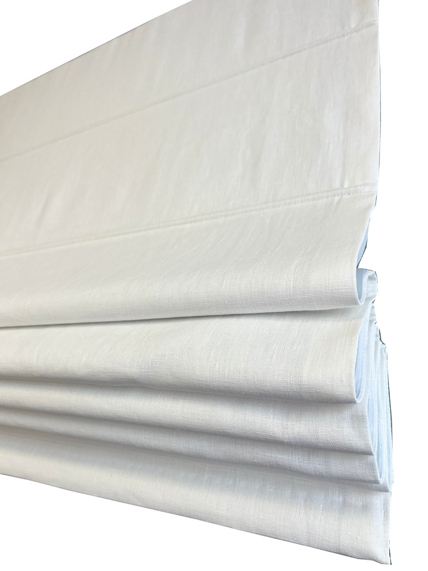 Tuscany white linen flat Roman shade — fold detail, folded up