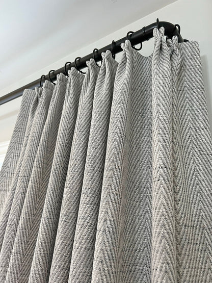 Corrie French pleat curtains on a black metal rod