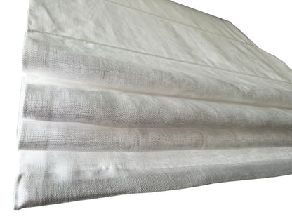 Fold stack detail of the flat Roman shade in white sheer linen — LOGANOVA