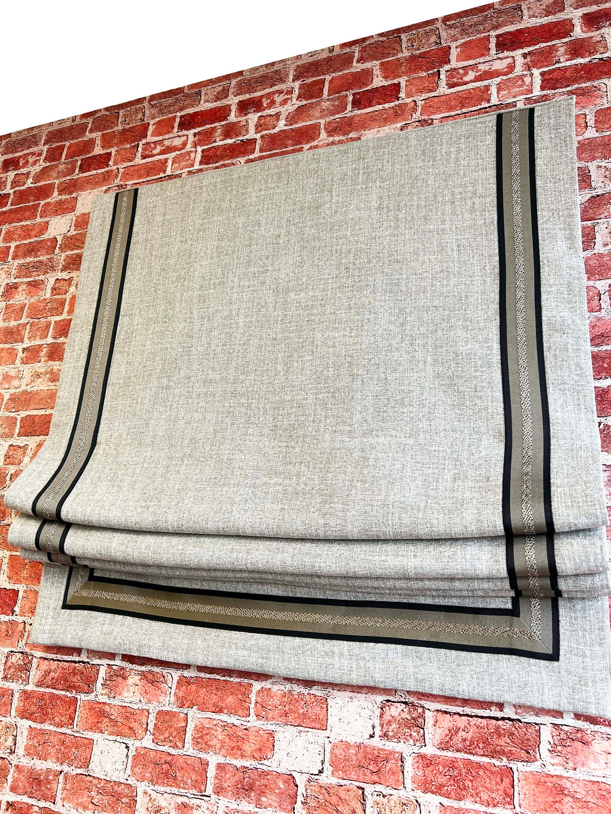 Side view of the Toronto Roman shade showing the trim inset from the edge