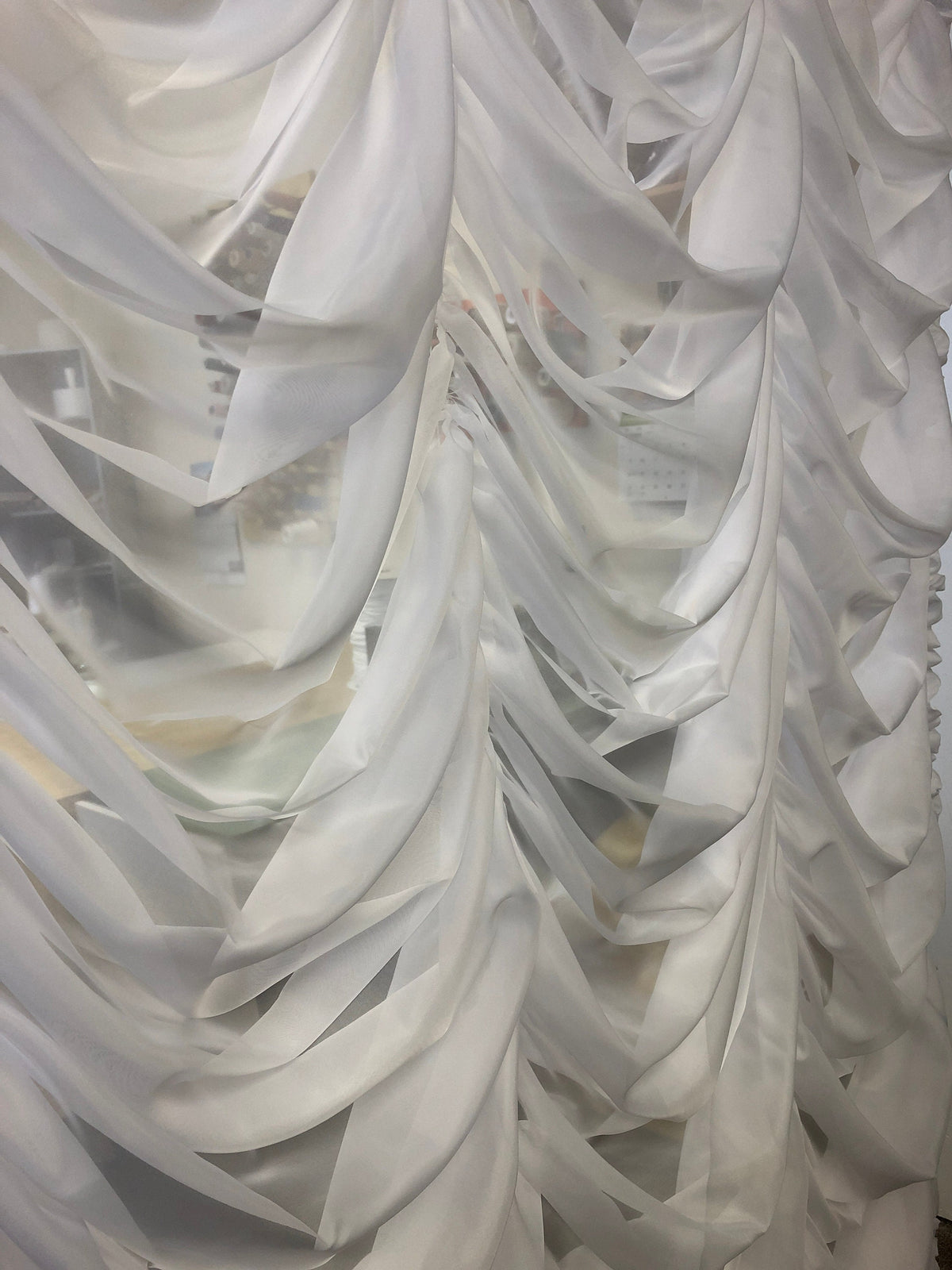 Austrian sheer shade detail, scalloped hem and vertical shirring