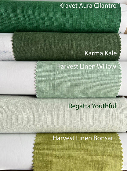 Green linen fabric samples for custom Roman shades: Kravet Aura Cilantro, Karma Kale, Harvest Linen Willow, Regatta Youthful and Harvest Linen Bonsai folded swatches.