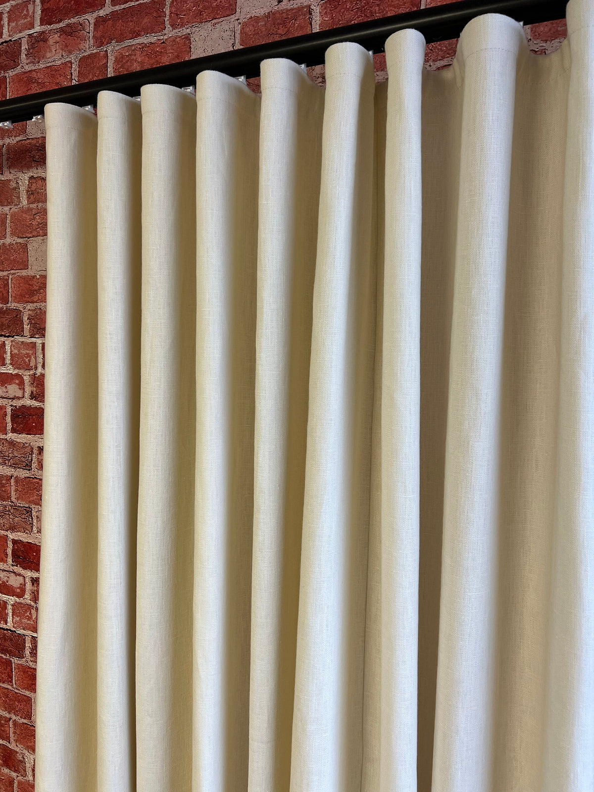 Tuscany 100% linen ripple fold drapery panel hanging full height at a window, unlined, custom size