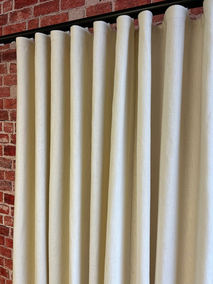 Tuscany 100% linen ripple fold drapery panel hanging full height at a window, unlined, custom size