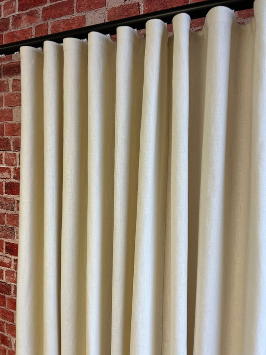 Tuscany 100% linen ripple fold drapery panel hanging full height at a window, unlined, custom size