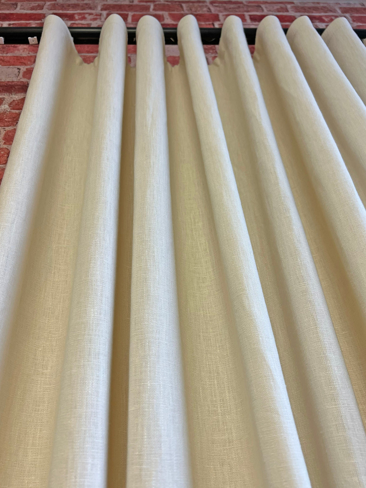 S-fold linen curtains on a ceiling channel track, even ripple from track to hem