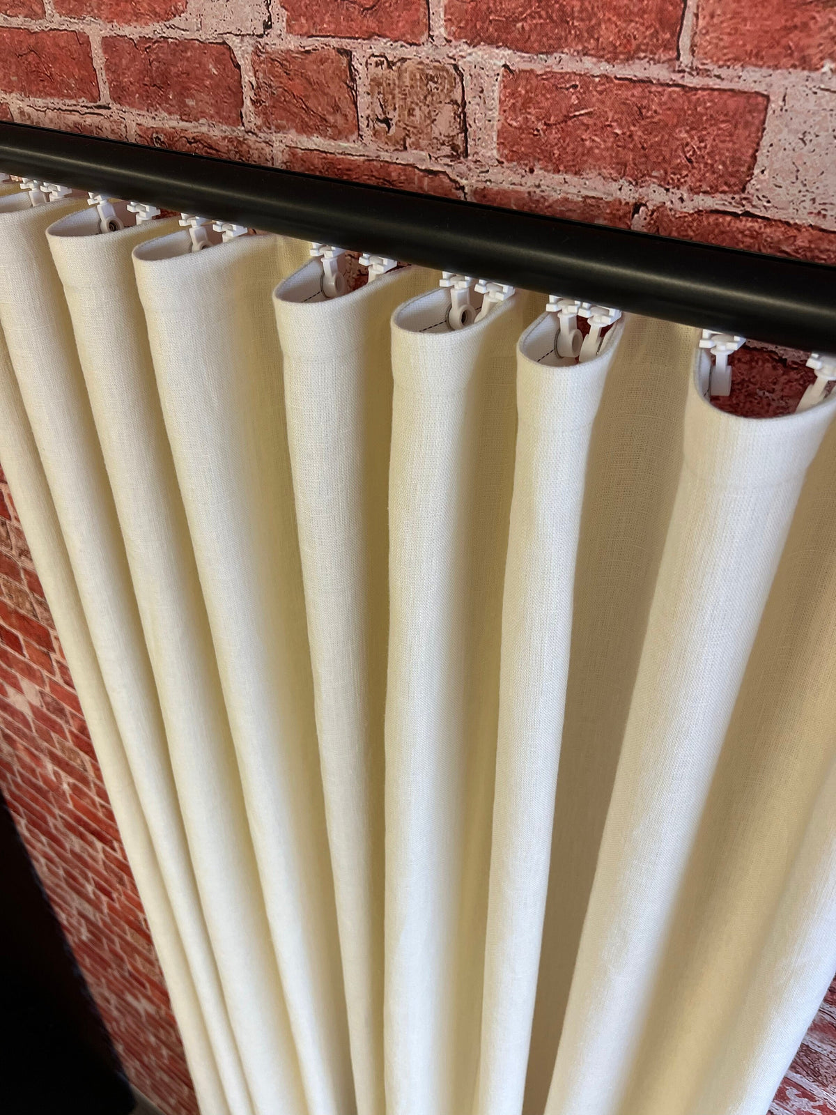 Custom ripple fold linen drapery in a room setting, floor to ceiling