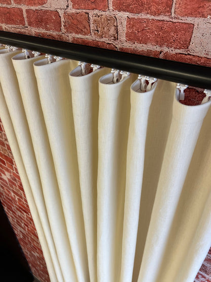 Custom ripple fold linen drapery in a room setting, floor to ceiling