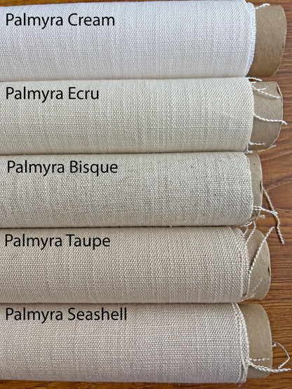 Palmyra roman shade in a bedroom window