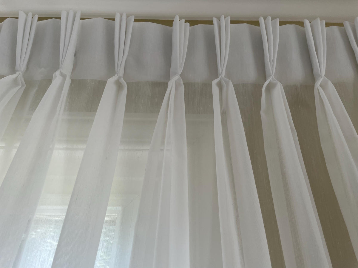 Marbella triple pleat sheer drapery panel at a window