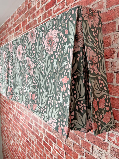 Pleated valance hanging above a window