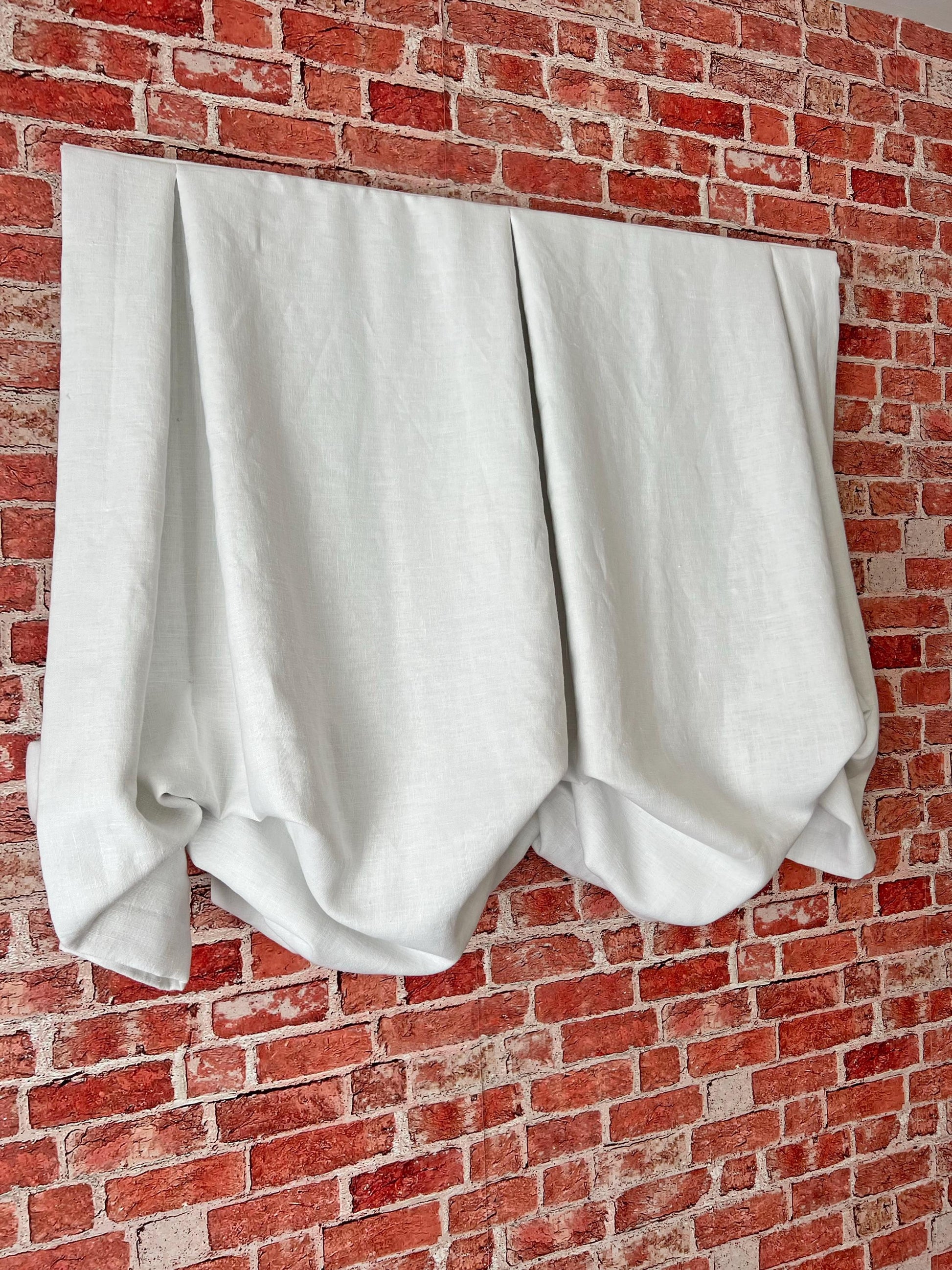 London Roman shade raised, centre sag and side tails — LOGANOVA