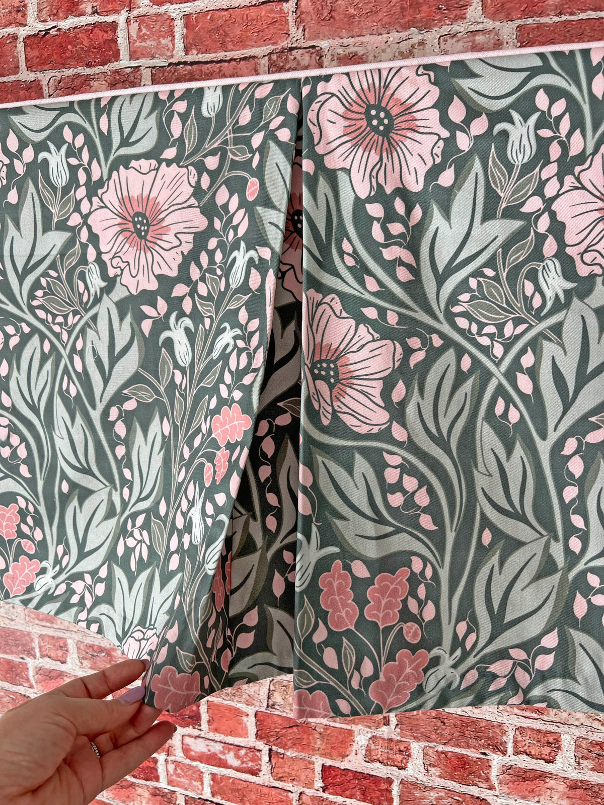 Arts & Crafts floral fabric folded, showing the white trim detail