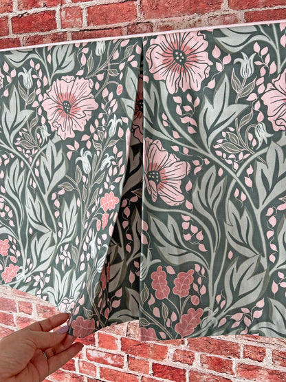 Arts & Crafts floral fabric folded, showing the white trim detail