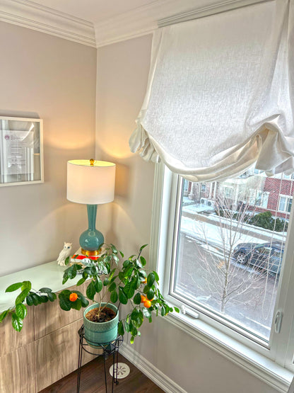 Tuscany linen London shade raised in a living room window — LOGANOVA