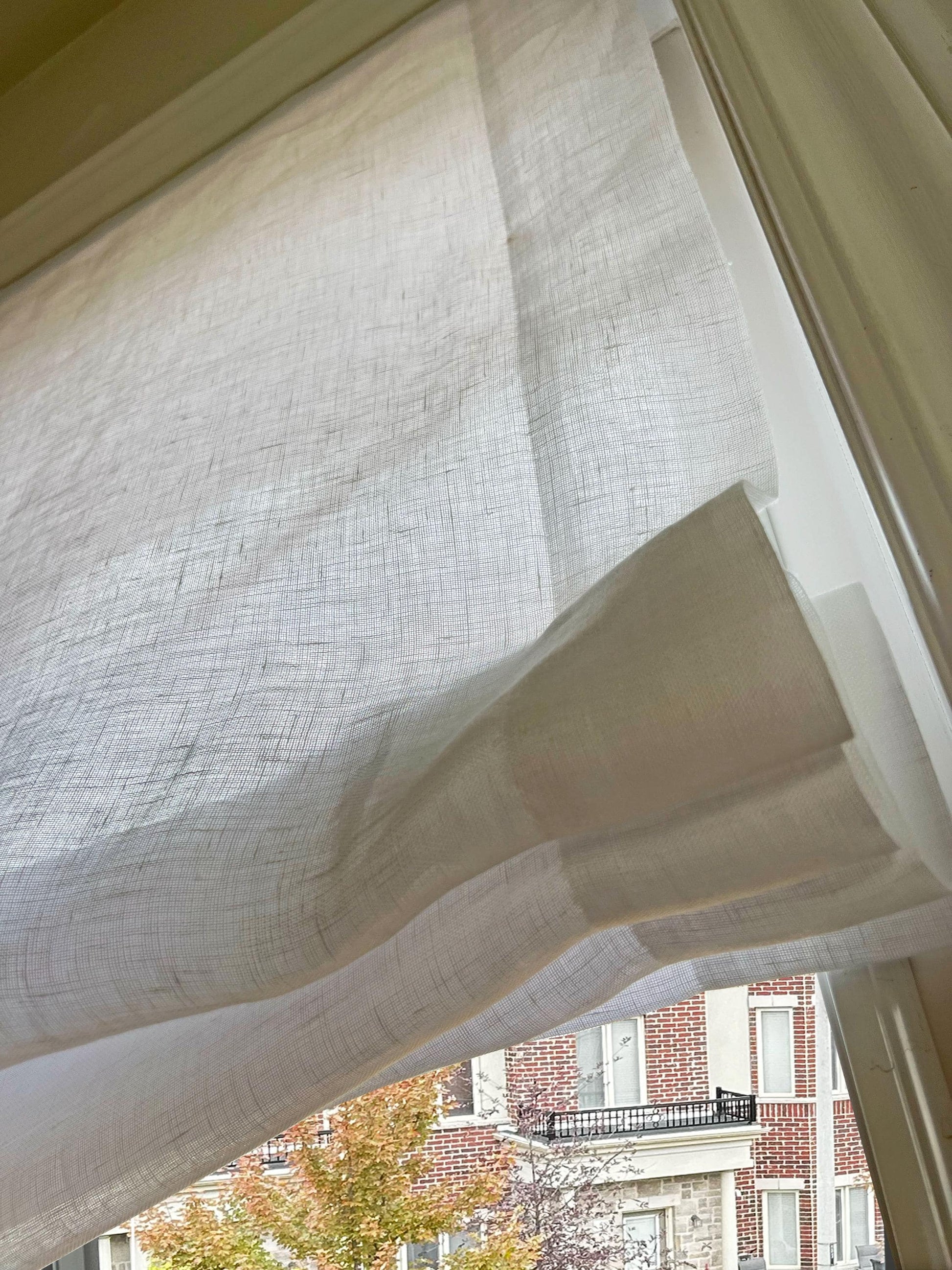 Relaxed fold detail of sheer 100% linen Utopia fabric, open weave up close — LOGANOVA