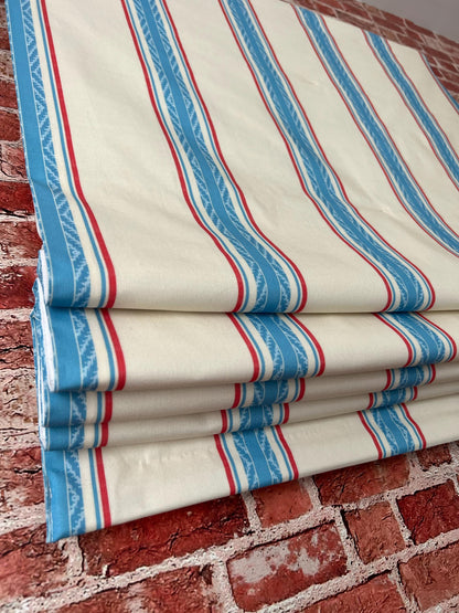 French Ticking Stripe relaxed Roman shade in a bathroom setting