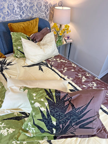 Green botanical bedding styled in a calm bedroom