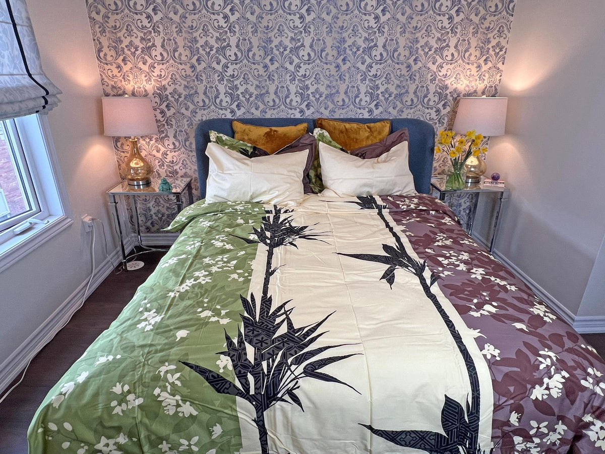 Botanical bamboo leaf cotton duvet cover set on a made bed