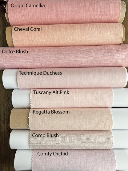 Daylight filtering through the linen blend flat Roman shade with scalloped wave hem