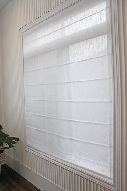 Lugano relaxed Roman shade mounted inside the window recess