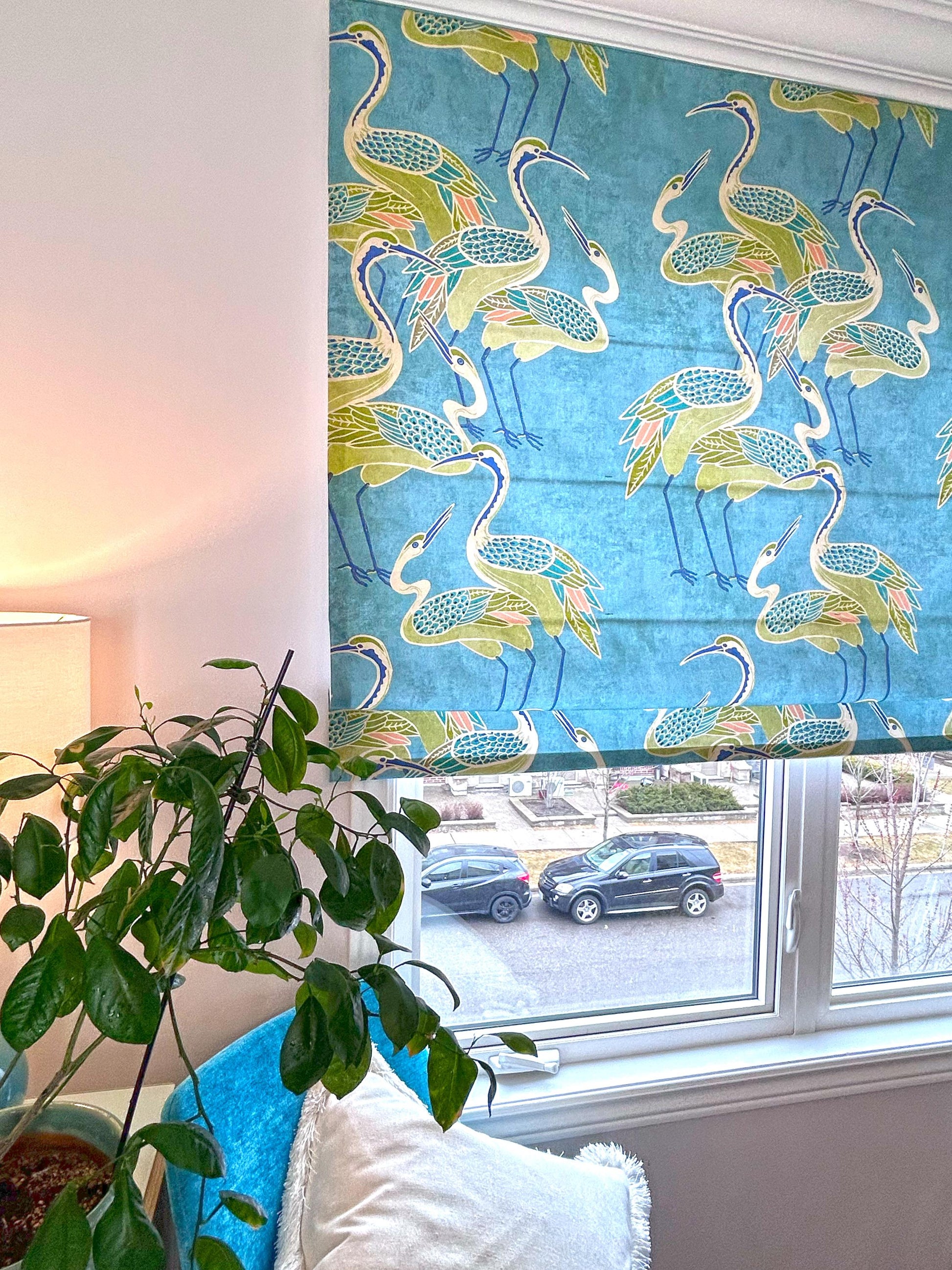 Deco Cranes pool-blue crane-print Roman shade, fully extended — front view