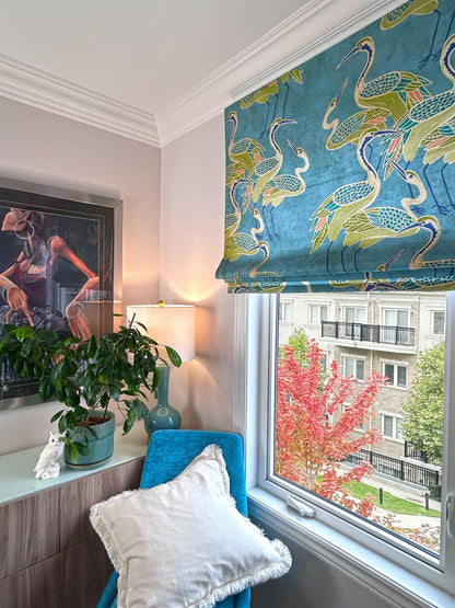 Deco Cranes Roman shade styled at a window — pool blue statement print