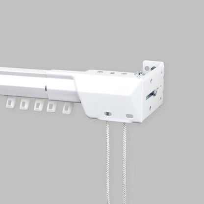 Traverse rod track profile close-up with glide slots and corner pulley with draw cords