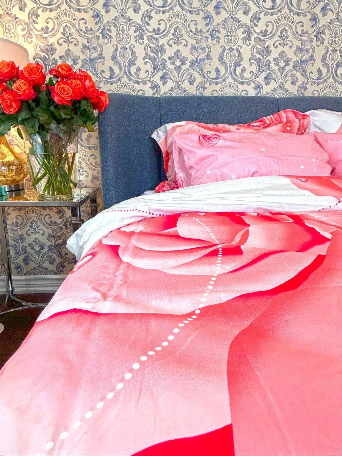 Blush and cream rose bedding styled in a soft bedroom
