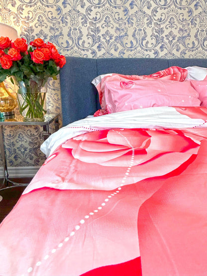 Blush and cream rose bedding styled in a soft bedroom