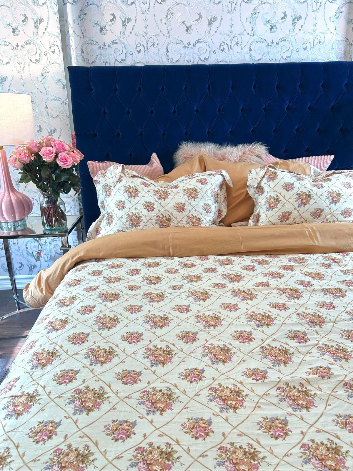 Tessa bedding set layered with coordinating pillows
