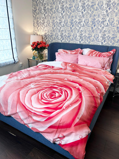 Pink rose print cotton duvet cover set on a made queen bed