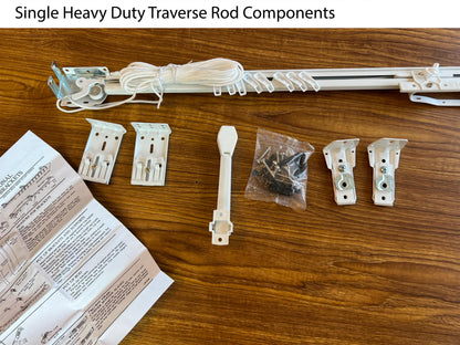 Heavy duty white traverse rod set with brackets, draw cord and hardware laid out — center open pinch pleat rod kit