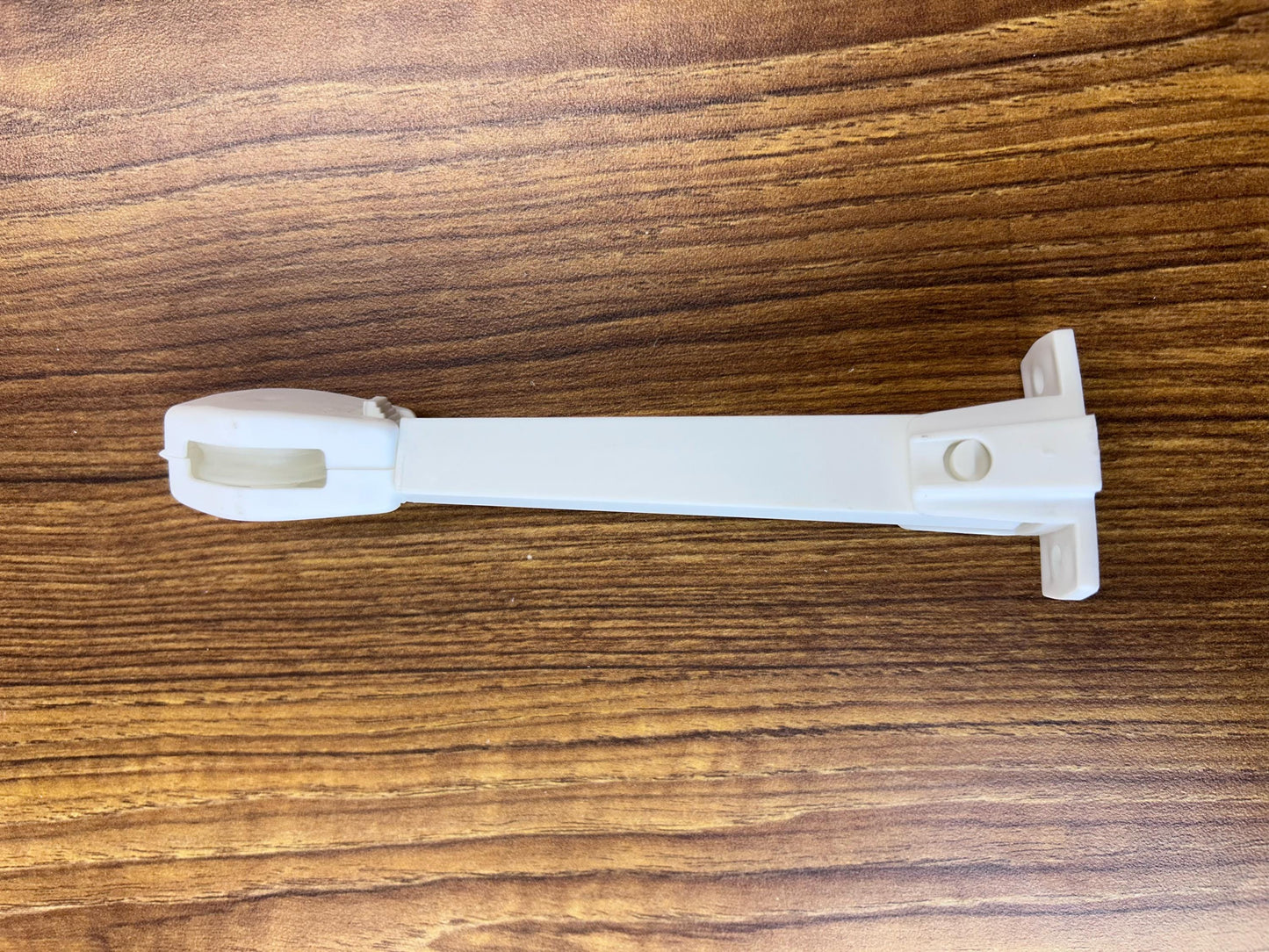 Cord tension guide for traverse rod draw cord — keeps cord taut and child-safe