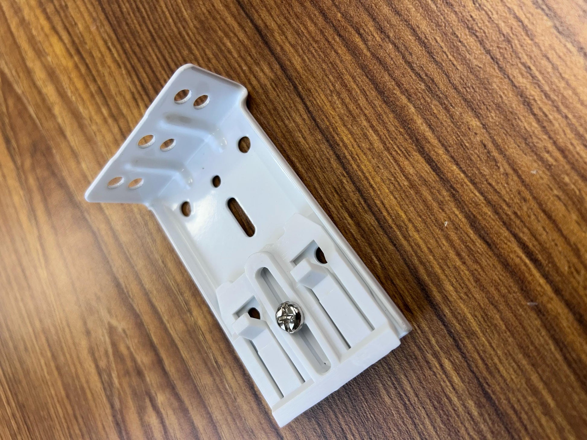 Adjustable wall bracket with multiple mounting holes for heavy duty traverse rod